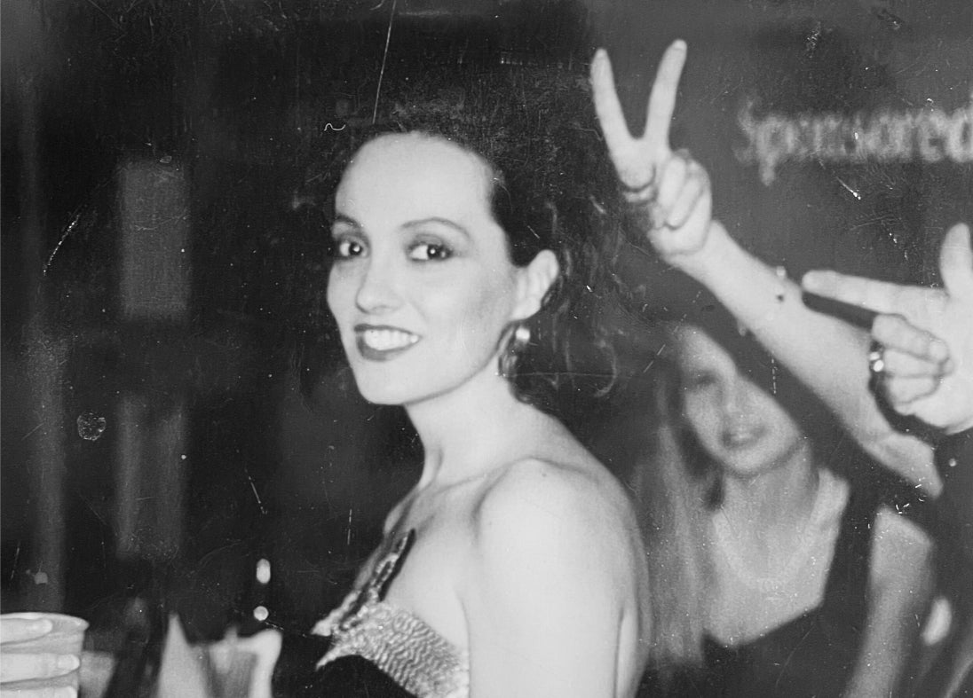 Lisa May photographed at a professional event early in her career, in evening dress with her hair styled up.