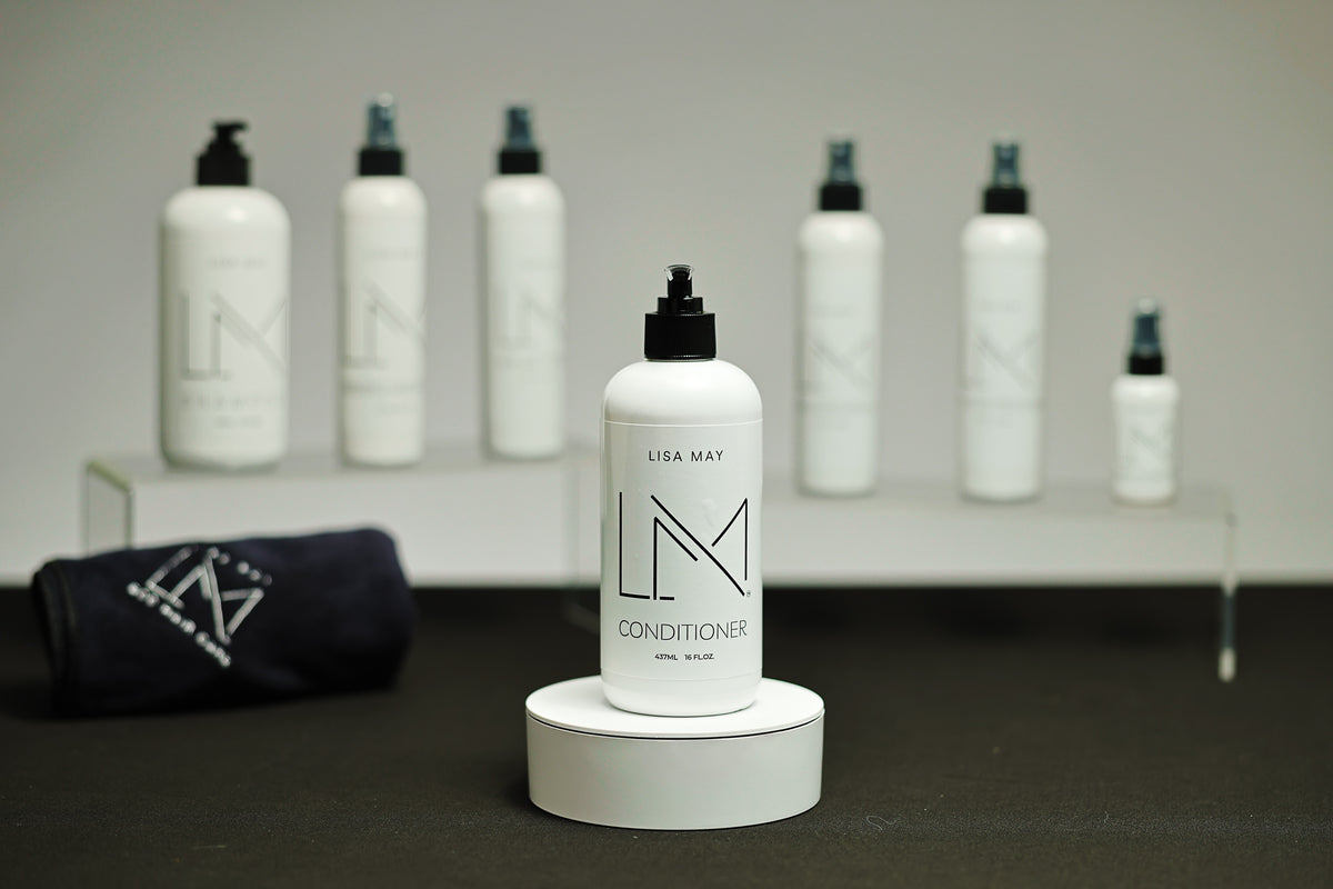 Lisa May Eco Hair Care Conditioner in a tall white pump bottle